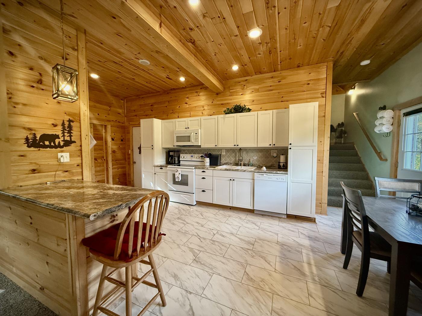 Bright open kitchen with white cabinets and an island